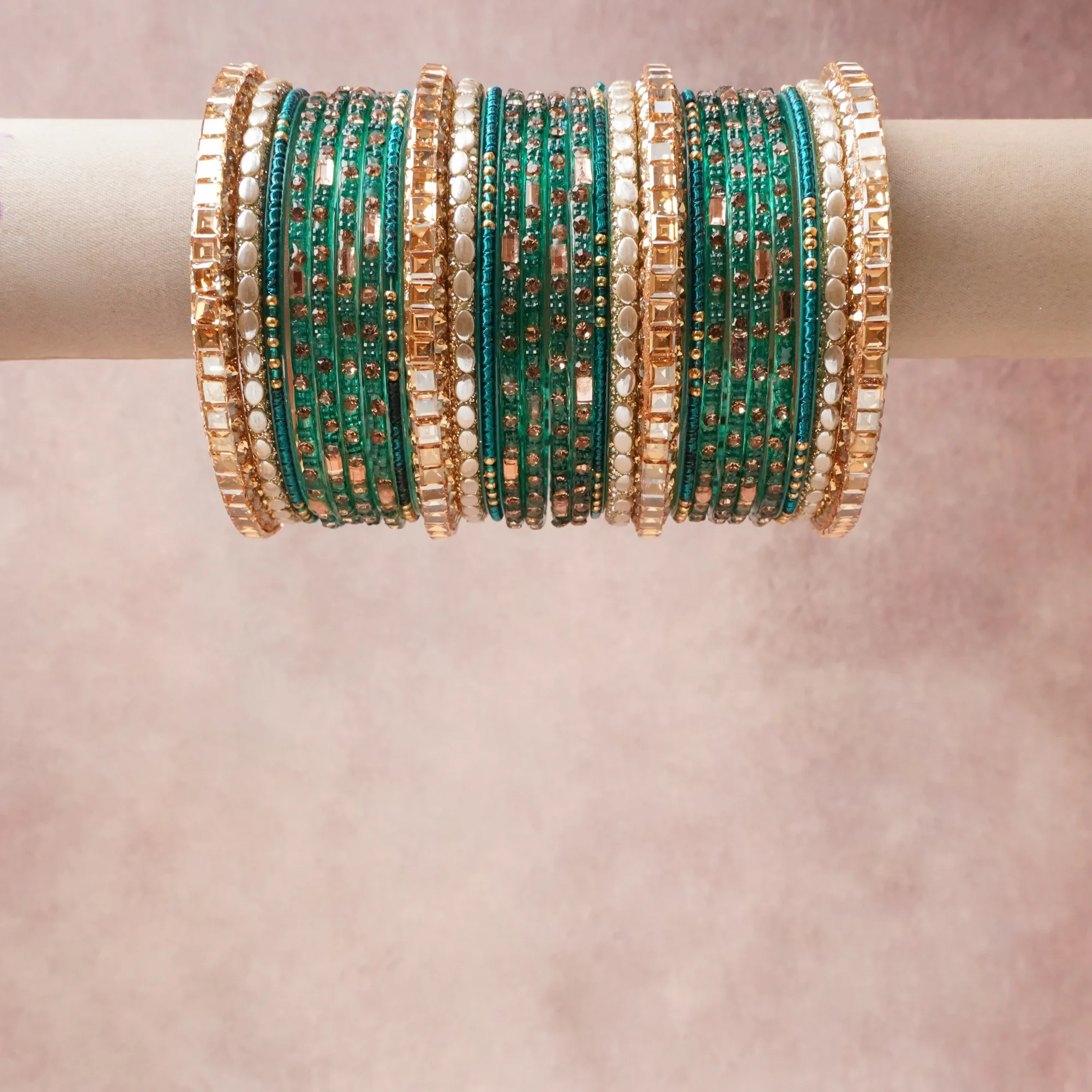 A grounding Deep Emerald Green forms the heart of the set, while touches of Champagne Peach, Cream, Clear Crystal add charm.

A thoughtful composition of Glass, Gold-Toned Metal, Faceted Stones, Opaque Beads, designed to feel complete without being heavy.
Each element layers seamlessly, creating a look that is refined, wearable and quietly striking.